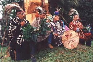 Mapuche people play instruments during a wedding ceremony.