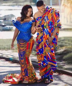 A Western African couple is wearing the Kente.
